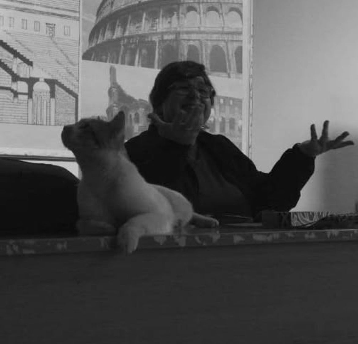 Dr. Nairy Hampikian in her Cairo studio, with one of her dogs and architectural drawings of the Colosseum behind her